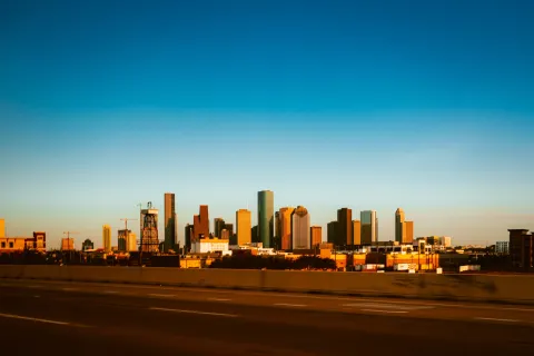 a city skyline at sunset