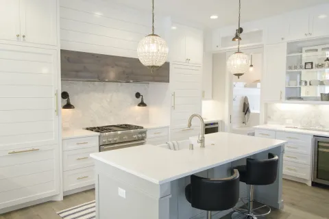 a kitchen with white cabinets