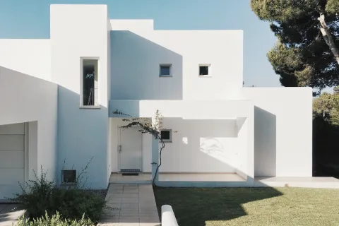 a white house with a driveway