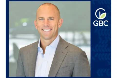 a man in a suit smiling