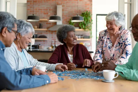 a group of people sitting around a table