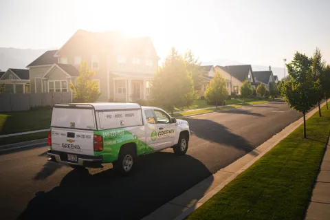 a white truck parked on the side of a road