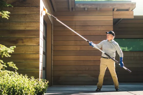 a man holding a broom