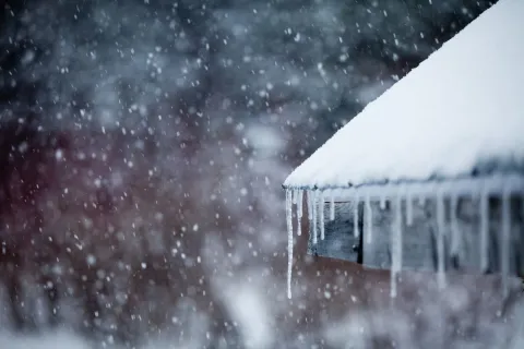 a house with snow on the roof