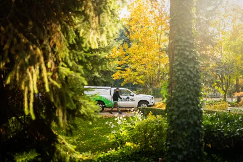 a technician walking next to Greenix truck