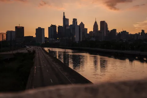a city skyline with a river