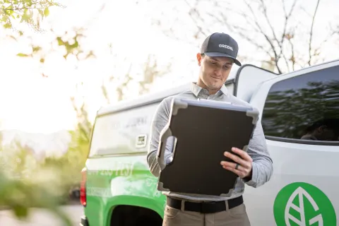 a person holding a laptop