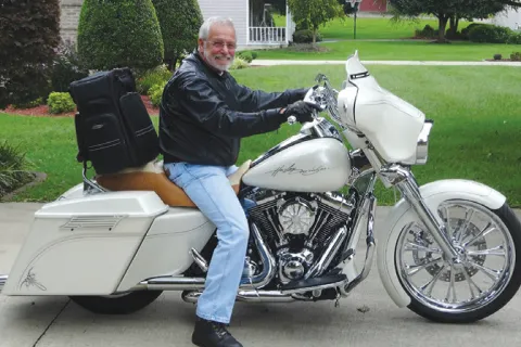 a person sitting on a motorcycle