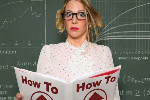 Woman with glasses reading a large book titled How To, surprised expression, chalkboard with graphs in background
