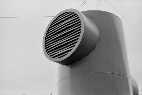 Air vent on the exterior of a Loganville, GA home illustrating the importance of duct sealing.
