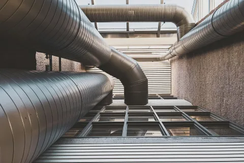 Industrial HVAC ductwork serving a Grayson, GA building, illustrating the importance of HVAC maintenance.
