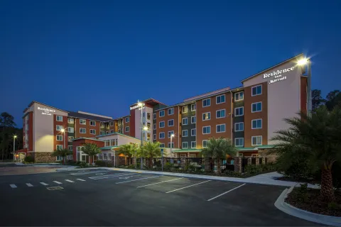a large building with a parking lot