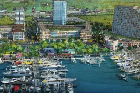 a body of water with boats and buildings around it