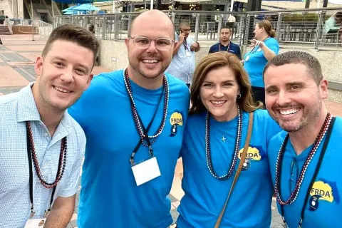 a group of people wearing medals