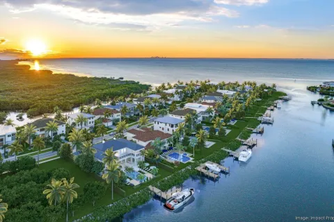 a body of water with boats and buildings along it