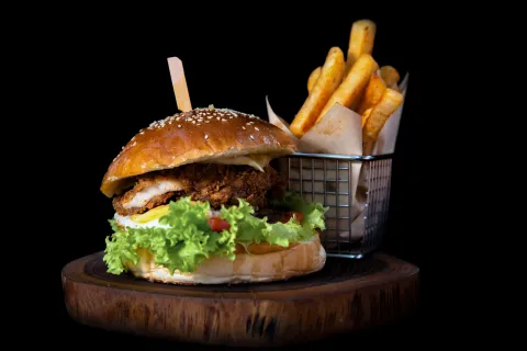 a burger on a wooden surface