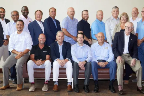 a group of men posing for a photo