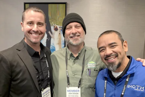 a group of men smiling