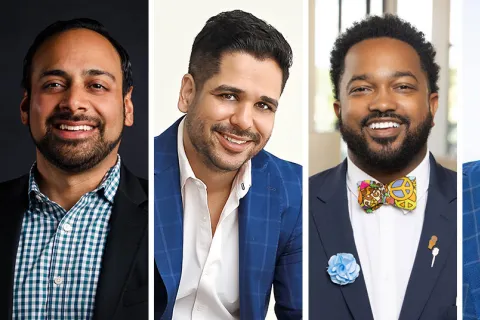 a group of men smiling