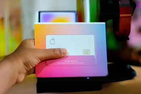 a hand holding a tablet