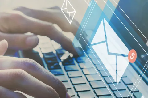 a person typing on a keyboard