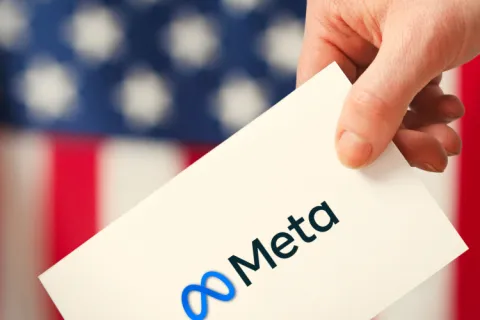 a hand holding a piece of paper