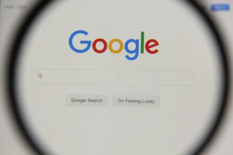 a white rectangular object with a blue circle and text on it