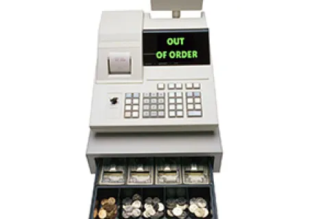 a white cash register with a digital display