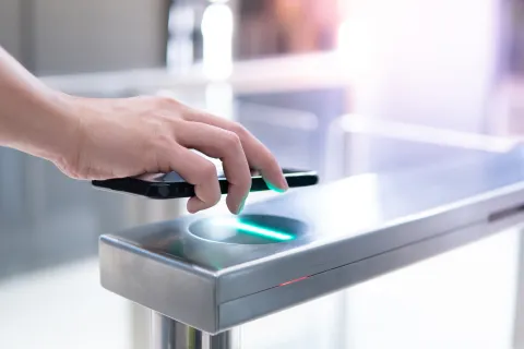 a hand on a touch screen device