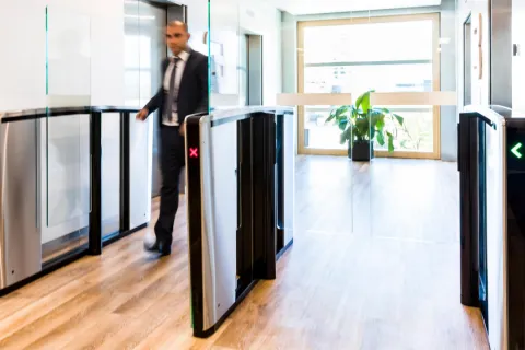 a person standing next to a computer