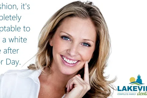 Smiling woman with white teeth promoting dental care and a fashion quote about wearing a white smile after Labor Day.