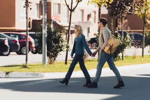 a man and a woman walking on a street