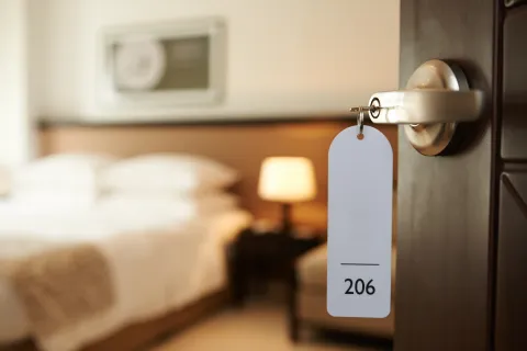 a room with a bed and a lamp