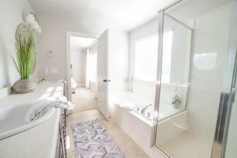 a bathroom with a tub and a shower