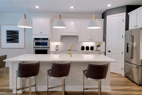 a kitchen with white cabinets