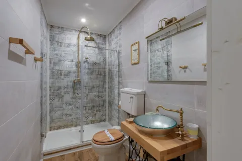 a bathroom with a tub toilet and sink