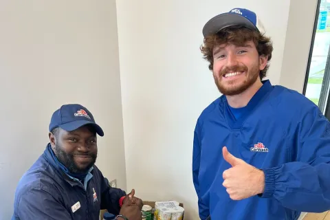 a couple of men posing for the camera