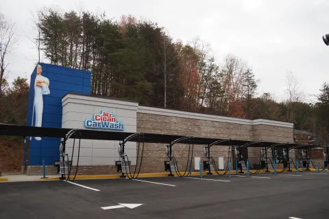 mr. clean car wash lot and buidling with two signs