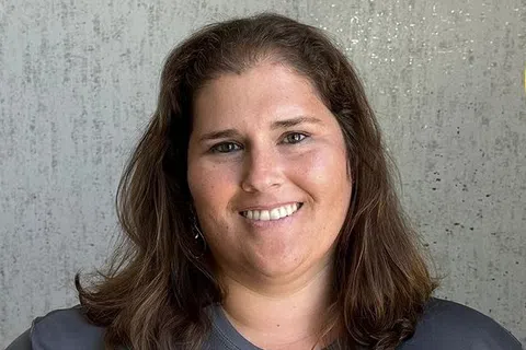 Michelle Collins, new PestMaster franchise owner for Milwaukee and Kenosha, WI, with 3 units, smiling in uniform.