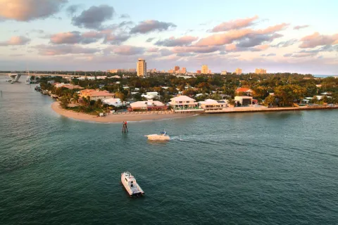 a body of water with boats and buildings along it