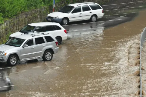 a group of cars parked in a flooded street