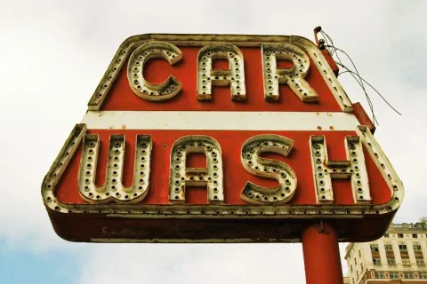 a sign with a red and white sign