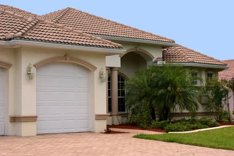 a house with a garage and trees