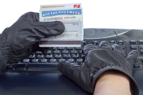 a person in a glove and gloves on a typewriter