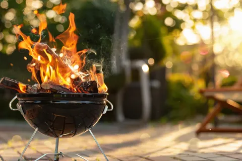 a black pot with fire in it