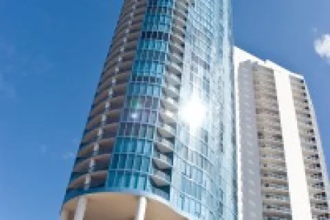 a tall building with a glass front