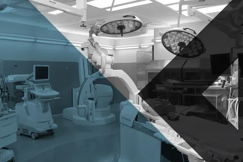 Modern hospital operating room with advanced medical equipment and surgical lights ready for procedures
