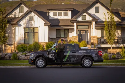 a person standing on a pickup truck
