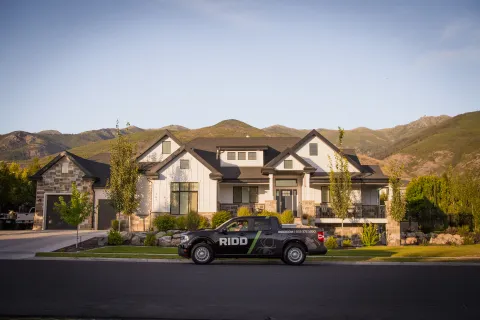 a police car parked in front of a house