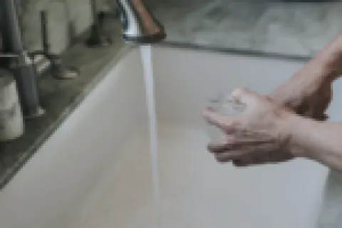 a plumber fixing a clogged drain in atlanta